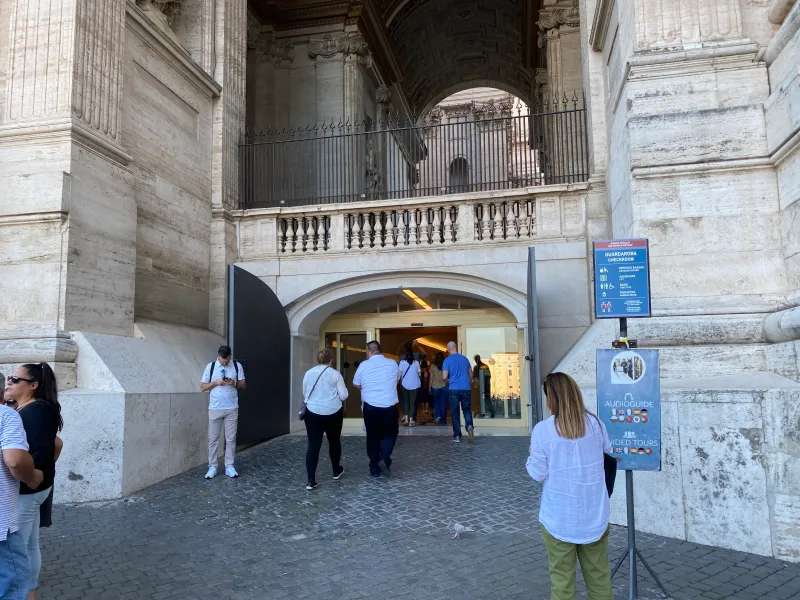 Use this entrance, just to the right of the steps.